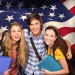 Composite image of students holding folders at college corridor